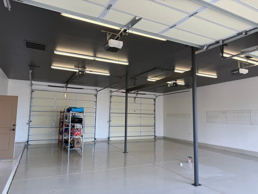 Garage epoxy floor coating with full ceiling and wall repaint β before and after