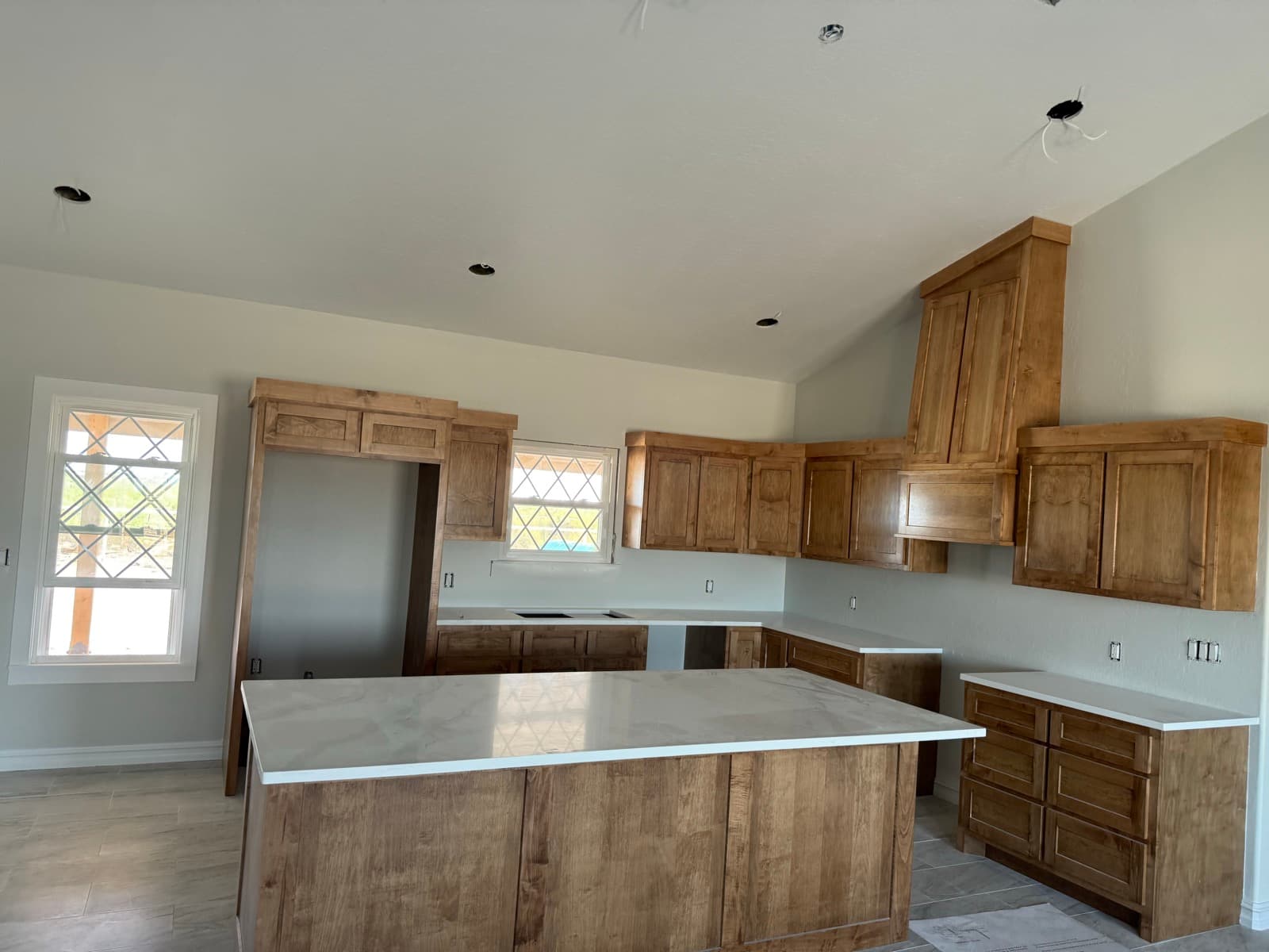 Kitchen with neutral walls and stained cabinets