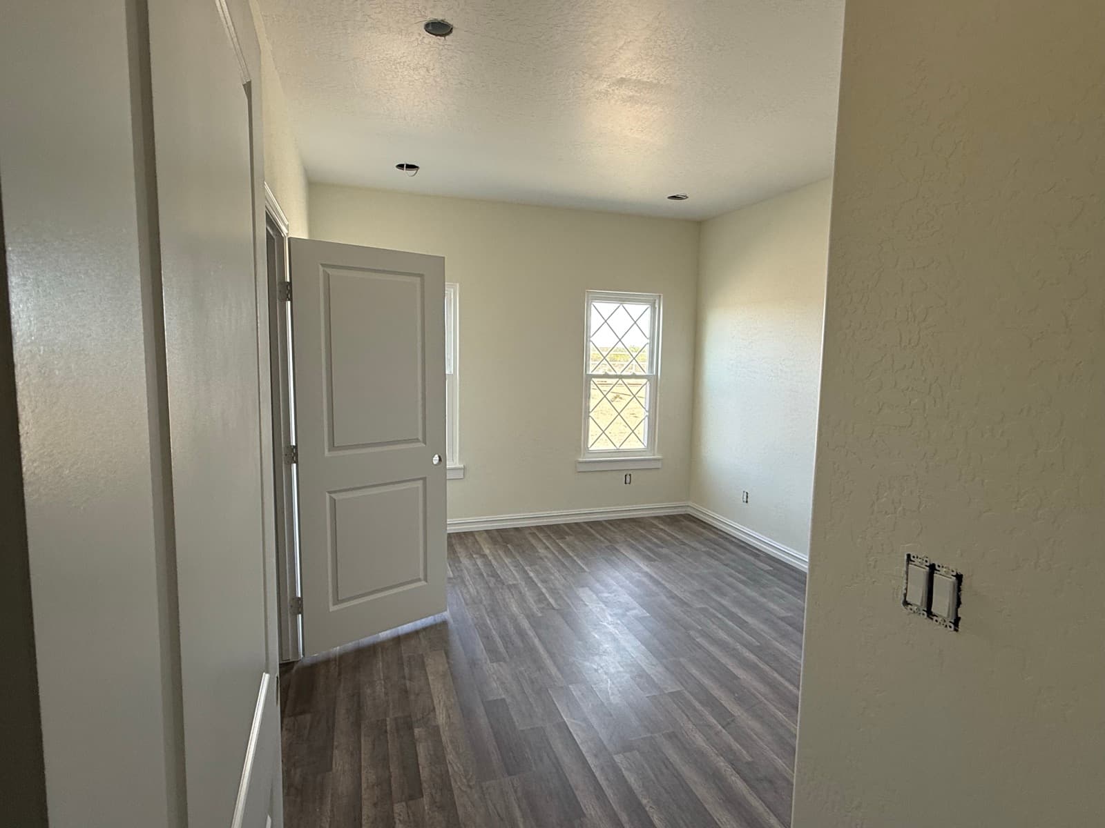 Bright bedroom with greige walls